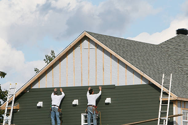 Professional Siding technician working in North Reading, MA